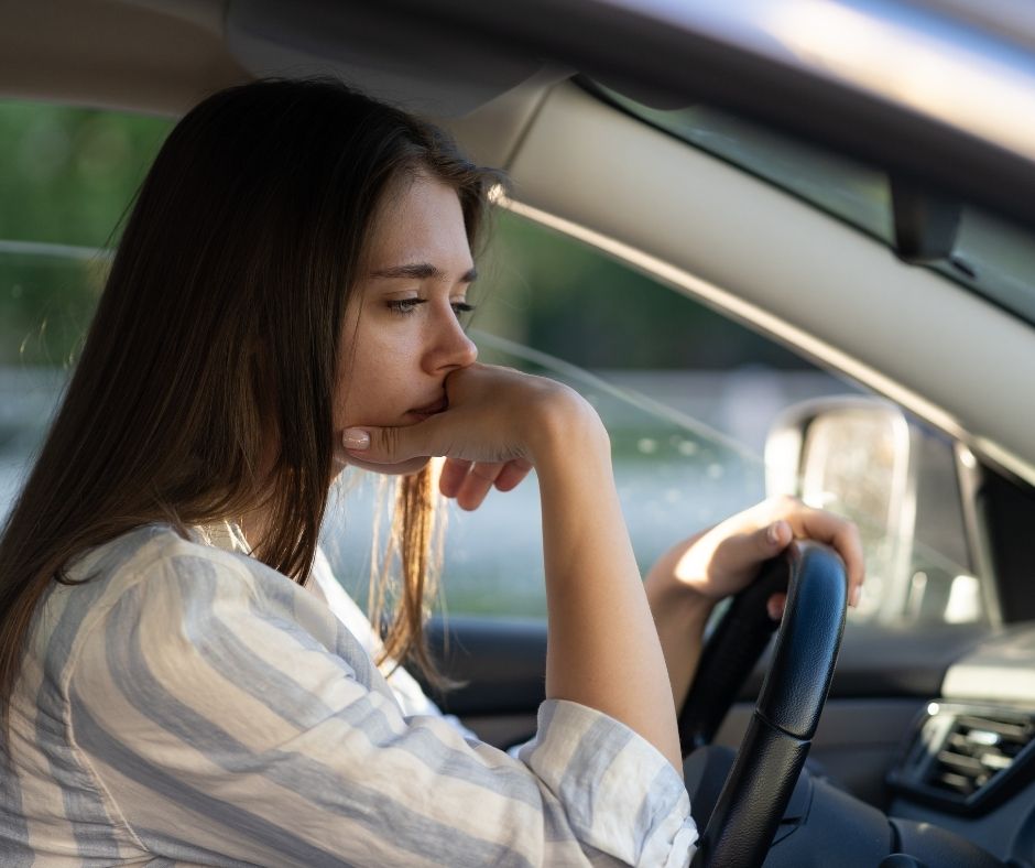 confident woman driving after anxiety treatment